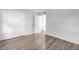 Bedroom featuring wood-look floors, a closet, and neutral-colored walls, offering a calming and versatile space at 12135 Environmental Dr # 2, New Port Richey, FL 34654