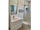 Modern bathroom showcasing a toilet, sink vanity, and a spacious glass-enclosed shower at 125 5Th Ne Ave # 240, St Petersburg, FL 33701