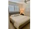 Relaxing bedroom features neutral tones, light-filtering blinds, and a comfortable queen-sized bed at 125 5Th Ne Ave # 240, St Petersburg, FL 33701