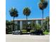 Inviting condo building featuring lush palm trees and well-maintained landscaping on a sunny day at 125 5Th Ne Ave # 240, St Petersburg, FL 33701