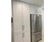 Modern kitchen featuring a stainless steel refrigerator and white cabinets at 125 5Th Ne Ave # 240, St Petersburg, FL 33701