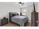 Cozy bedroom with plush carpet, ceiling fan, ample natural light, and a comfortable bed at 13411 Beechberry Dr, Riverview, FL 33579