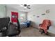 Bedroom with a ceiling fan, window, and desk at 13411 Beechberry Dr, Riverview, FL 33579