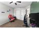 Neutral toned bedroom with carpeted floors, ceiling fan, and an open closet for flexible storage at 13411 Beechberry Dr, Riverview, FL 33579