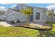 Attractive two-story home with well-kept lawn and front yard landscaping, including decorative stone features at 13411 Beechberry Dr, Riverview, FL 33579