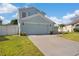 Charming two-story home with an attached garage, well-maintained lawn, and tasteful landscaping features at 13411 Beechberry Dr, Riverview, FL 33579
