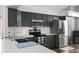 Well-equipped kitchen with stainless appliances, a center island, and modern finishes for a contemporary feel at 13411 Beechberry Dr, Riverview, FL 33579