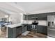 Updated kitchen features stainless steel appliances, sleek countertops, and an open design for easy entertaining at 13411 Beechberry Dr, Riverview, FL 33579