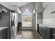 Modern kitchen with stainless steel appliances, ample cabinet space, and a bright, airy atmosphere at 13411 Beechberry Dr, Riverview, FL 33579