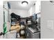 Well-lit laundry room featuring a modern washer and dryer, storage shelves and white cabinets for added convenience at 13411 Beechberry Dr, Riverview, FL 33579