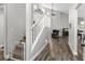 View of living room from the stairs showcases the open floor plan and fireplace at 13411 Beechberry Dr, Riverview, FL 33579