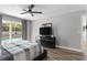 Bedroom featuring wood floors, ceiling fan, and sliding glass doors offering a view of the pool at 13411 Beechberry Dr, Riverview, FL 33579