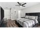Main bedroom featuring wood floors, a ceiling fan, and multiple closets at 13411 Beechberry Dr, Riverview, FL 33579