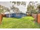 Backyard featuring grass and a view of the house at 1466 Laconia W Dr, Clearwater, FL 33764