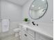 Modern bathroom with sleek fixtures, large vanity, and updated shower at 1466 Laconia W Dr, Clearwater, FL 33764