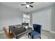 Bedroom with wood-look tile floors, ceiling fan, and closet at 1466 Laconia W Dr, Clearwater, FL 33764