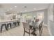 Open-concept dining area with a view of the updated kitchen at 1466 Laconia W Dr, Clearwater, FL 33764