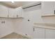 Bright laundry room with cabinets and countertop space at 1466 Laconia W Dr, Clearwater, FL 33764