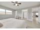 Bright main bedroom with hardwood floors and neutral paint at 1466 Laconia W Dr, Clearwater, FL 33764