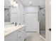 Bathroom with double vanity and glass enclosed shower at 2472 Orange Harvest Pl, Seffner, FL 33584
