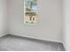Bedroom features neutral colored carpet, white walls and natural lighting at 2472 Orange Harvest Pl, Seffner, FL 33584