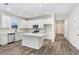 Modern kitchen with stainless steel appliances and a large center island at 2472 Orange Harvest Pl, Seffner, FL 33584
