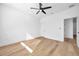 Spacious bedroom boasts modern wood floors and a sleek ceiling fan for comfort at 2608 W Columbus Dr # 2, Tampa, FL 33607