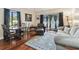 Cozy living room featuring wood floors, modern decor, and abundant natural light from the sliding doors at 2933 Lichen Ln # A, Clearwater, FL 33760