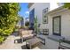 Inviting back patio features outdoor furniture, greenery, and seamless access to the main house at 3121 Prescott N St, St Petersburg, FL 33713