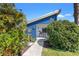 Charming blue house with modern design and lush landscaping at 3121 Prescott N St, St Petersburg, FL 33713