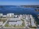 Stunning aerial view of waterfront properties, bay, and vibrant coastal community at 340 Causeway Blvd # 108, Dunedin, FL 34698