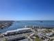 Beautiful aerial view of a coastal town, waterfront properties, and scenic bay at 340 Causeway Blvd # 108, Dunedin, FL 34698