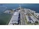 Aerial of waterfront community featuring condos, coastal living, docks and bay views with bridge access at 340 Causeway Blvd # 108, Dunedin, FL 34698