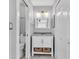 Well-organized bathroom with vanity, granite top, cabinet, and fixtures at 340 Causeway Blvd # 108, Dunedin, FL 34698