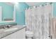 Well-maintained bathroom featuring a sink and a shower with modern fixtures at 340 Causeway Blvd # 108, Dunedin, FL 34698