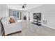 Light-filled living room with sliding glass doors to the outside and neutral wall color at 340 Causeway Blvd # 108, Dunedin, FL 34698