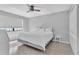 Comfortable main bedroom with ceiling fan, neutral walls, ample light, and closet at 340 Causeway Blvd # 108, Dunedin, FL 34698