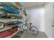 Organized storage room with shelving and a bicycle, perfect for keeping belongings tidy at 340 Causeway Blvd # 108, Dunedin, FL 34698
