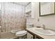 Bathroom featuring a shower and tub with coastal-themed shower curtain at 3921 Chris Dr, Wesley Chapel, FL 33543