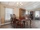 Charming dining area with a classic wooden table and decorative furnishings at 3921 Chris Dr, Wesley Chapel, FL 33543