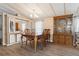 Elegant dining room with wooden table, chairs, and built-in cabinets at 3921 Chris Dr, Wesley Chapel, FL 33543