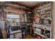 Functional garage featuring pegboard walls, shelving, and workbench space at 3921 Chris Dr, Wesley Chapel, FL 33543