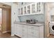 Kitchen featuring countertop appliances and overhead glass front cabinetry at 3921 Chris Dr, Wesley Chapel, FL 33543