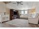 Comfortable living room with a large sectional sofa and entertainment center at 3921 Chris Dr, Wesley Chapel, FL 33543
