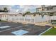Pool area with a white fence, designated parking, and an accessible entrance at 3921 Chris Dr, Wesley Chapel, FL 33543