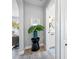 Hallway showcases neutral walls and a peek into the dining room and bathroom at 4100 3Rd S Ave, St Petersburg, FL 33711