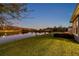 Picturesque view of the lake from the backyard, offering a peaceful and scenic outdoor space at 4522 Tramanto Ln, Wesley Chapel, FL 33543