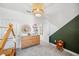 Bright, well-lit bedroom showcasing a neutral color scheme, tasteful decor, and a charming wooden house bed at 4522 Tramanto Ln, Wesley Chapel, FL 33543