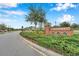 Welcome to Savona: A beautifully landscaped entrance sign invites you to this attractive community at 4522 Tramanto Ln, Wesley Chapel, FL 33543