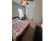 Comfortable bedroom with a bed, TV, fan, and natural lighting from the window at 4632 Chatterton Way, Riverview, FL 33578